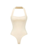 Body Melia Butter Yellow z dekoltem caro i dołem typu figi na jasnym tle