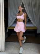 Pasteloworóżowa spódnica mini Skirt Glow z zaokrąglonym rozcięciem na nodze