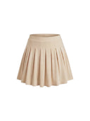Rozkloszowana spódniczka mini Court Skirt w cielistym odcieniu Body Nude z drobnymi plisami